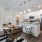 Modern kitchen at Aldon at Keys Crossing in Greenville, SC, featuring a stylish chef’s island with seating, contemporary appliances, and sleek countertops.