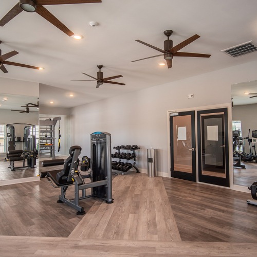 fitness center with large mirrors